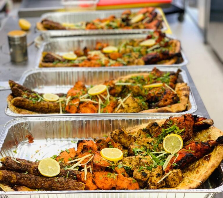 Indian buffet with naan, curries, and desserts