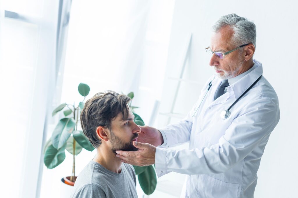 ENT Specialist in Gurgaon examining patient with ear and throat symptoms